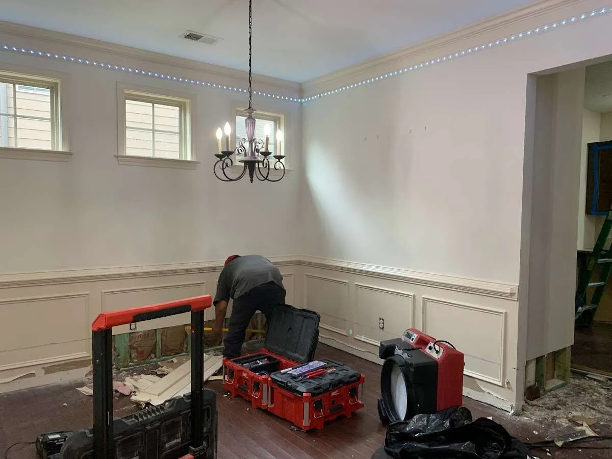 Restoration technician with professional equipment in Guilford